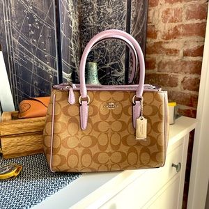 Brand new Coach purse, handheld or cross-body (straps inside).